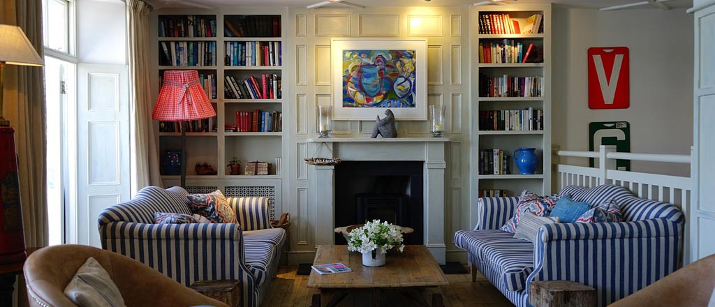 Vertical storage is one way to maximize space in a one-room apartment.